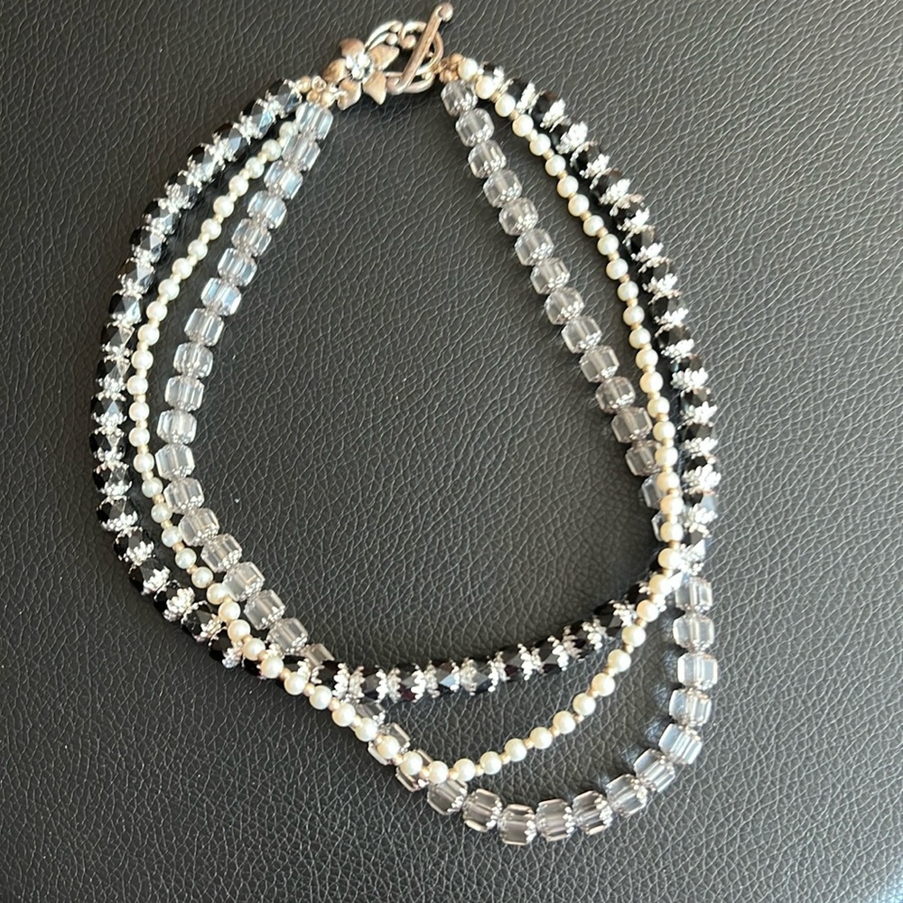 Triple strand Necklace of Black, Clear, Silver accents, and Pearls